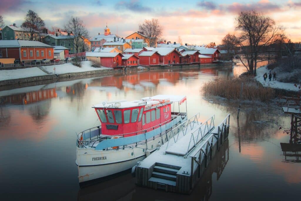 Picturesque Finnish river boat and houses